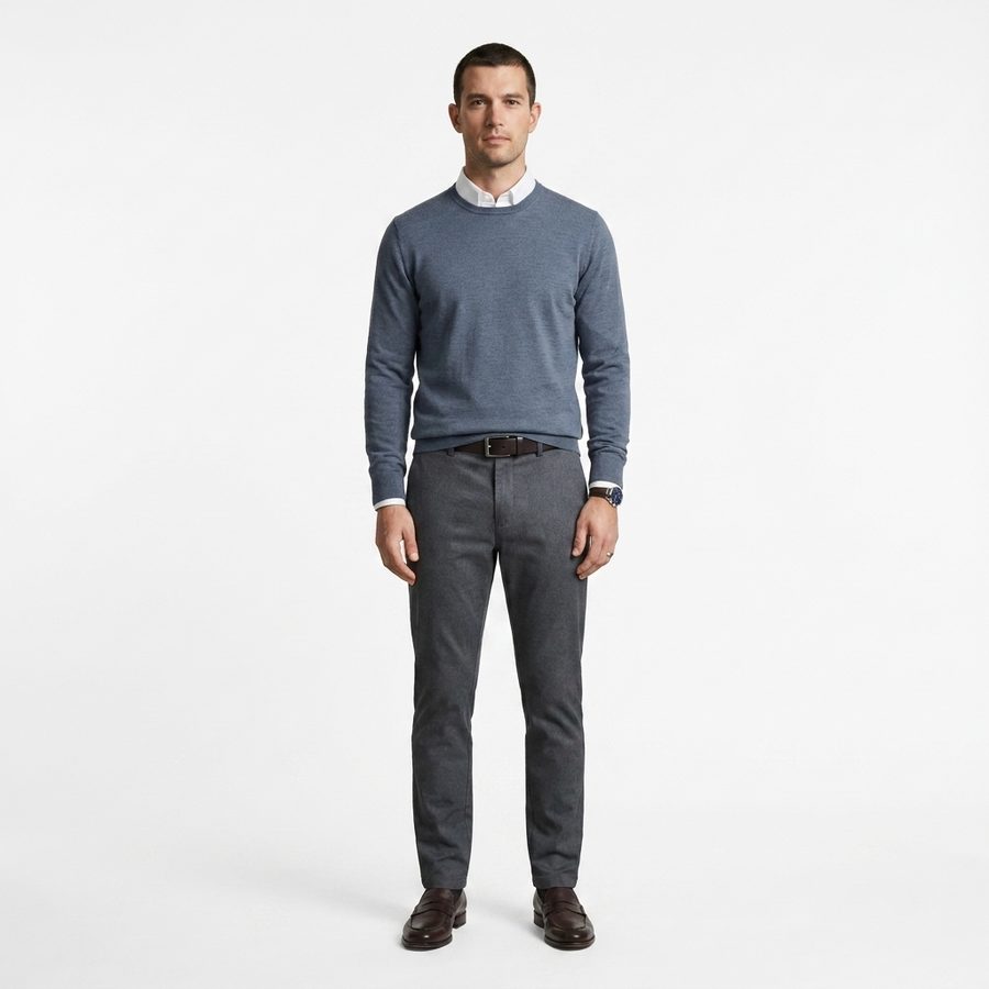 The app's render of the figure in a weekend look: blue-grey knit over a shirt with grey trousers.