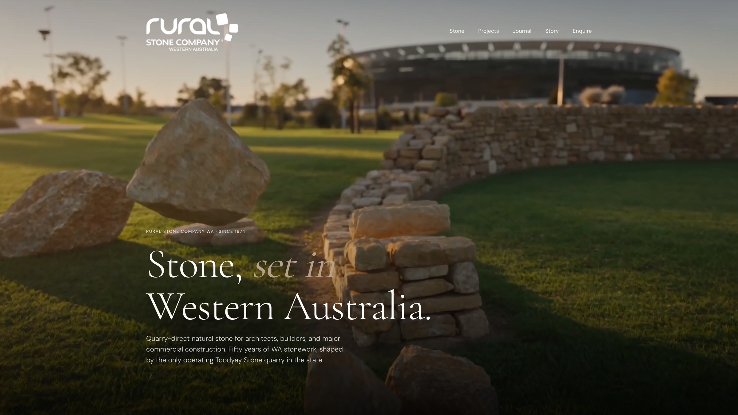 Rural Stone Company WA home page. A dry-stone wall and quarried boulders in front of Optus Stadium, with the headline Stone, set in Western Australia.
